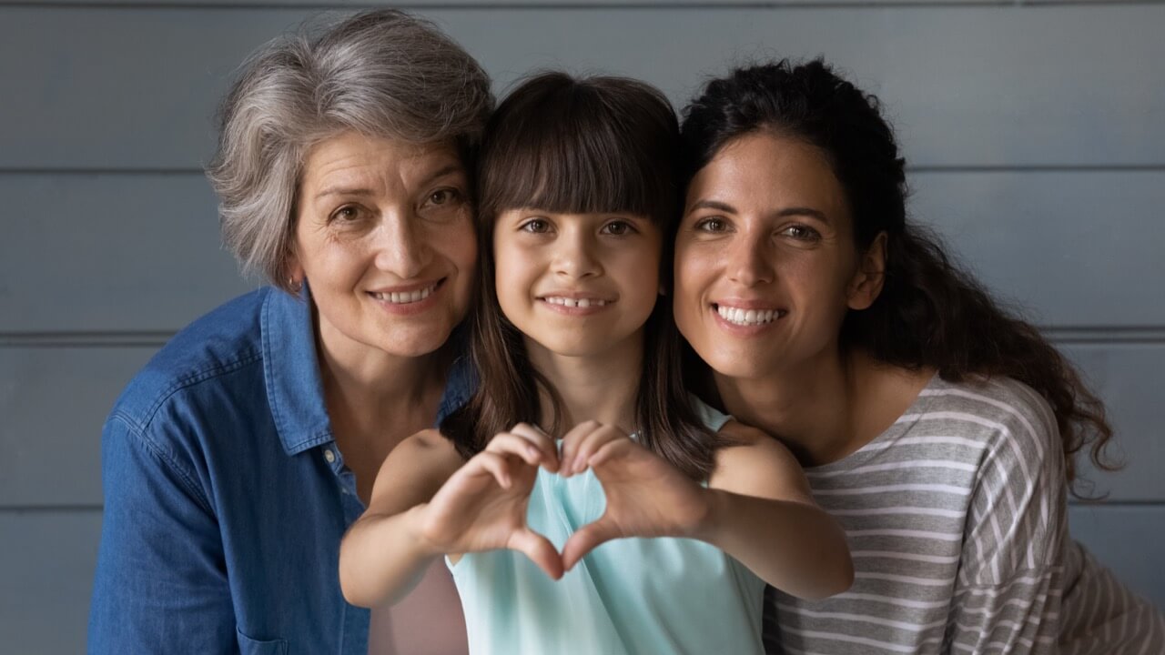 family with kid heart hands_compressed